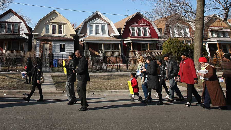 A collage of diverse people in hexagon frames against a blue geometric background.